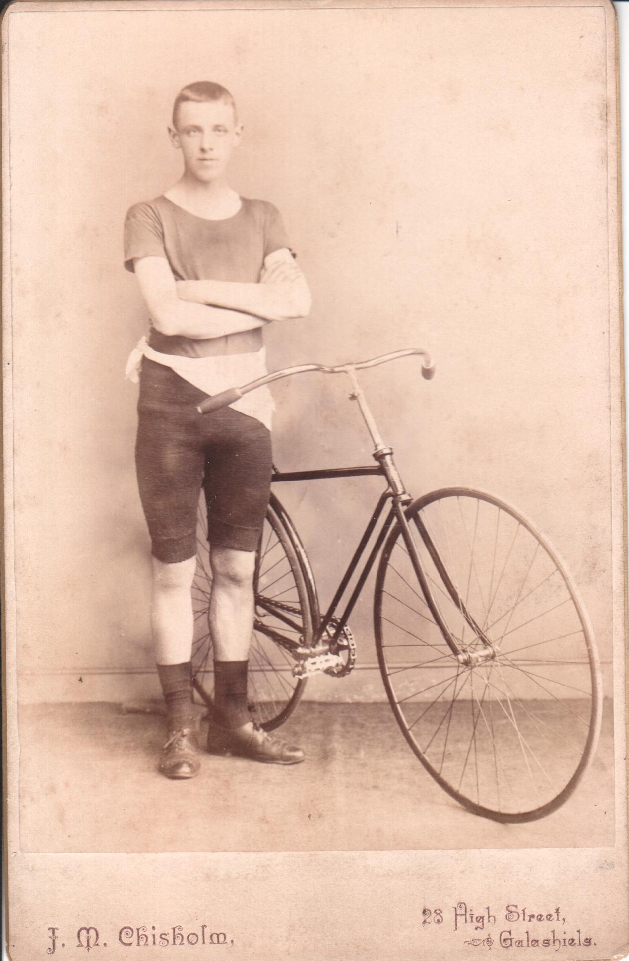 Young gent with solid tire racing safety circa 1890